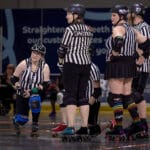 Photo of refs conferring.